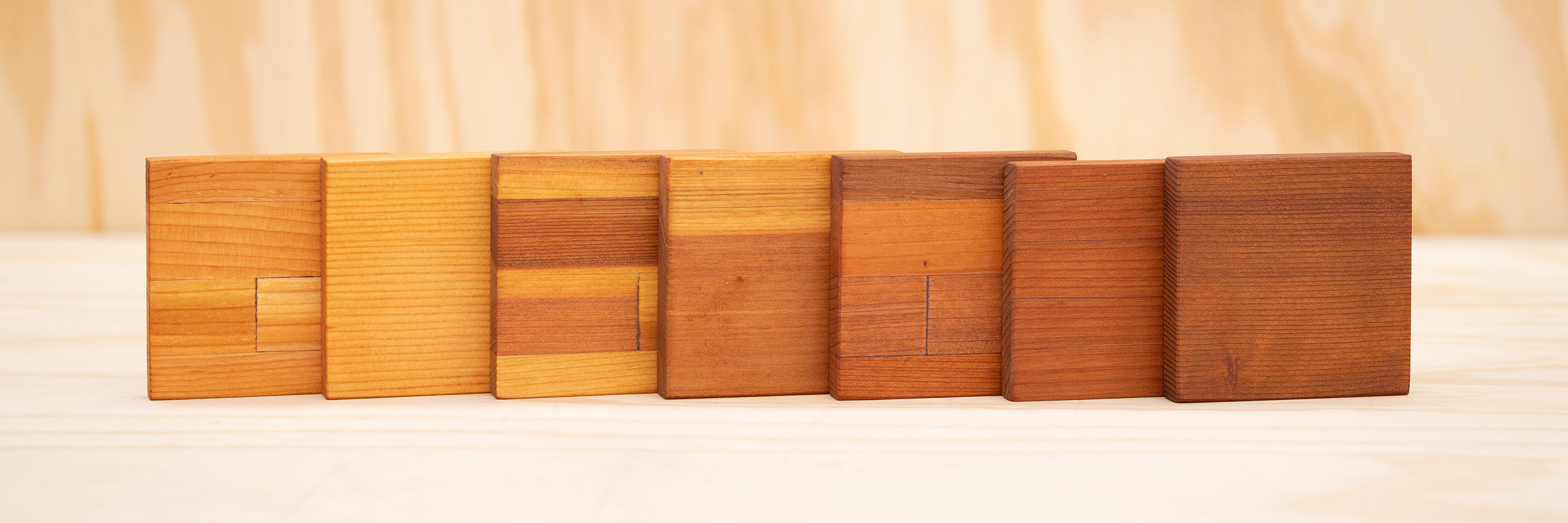 All seven wood grade samples with Transparent Premium Sealant