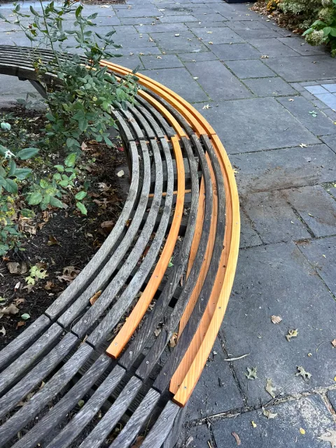 New outer slats following the curve of the old bench
