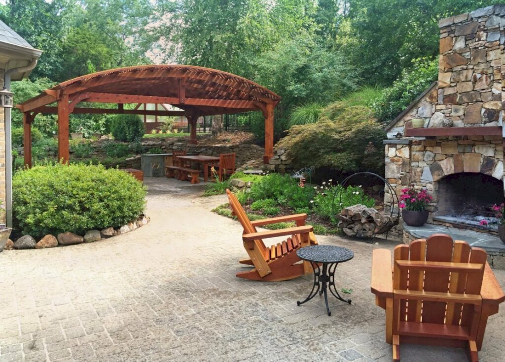 Left to right: Viking Pergola DIY Kit, San Francisco Redwood Patio Table, and Adirondack Wooden Rocking Chairs. Photo Courtesy of Diego B. of Huntsville, AL.