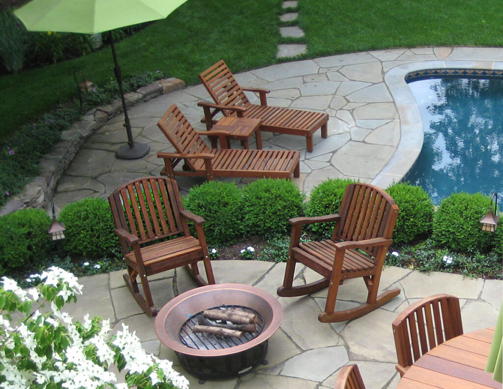 Lower Level: Pool Loungers and Terrace Outdoor Coffee Table. Upper Level: Luna Rocking Chairs. Photo courtesy of S. Salmon of Collingswood, NJ