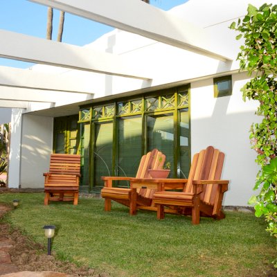 Adirondack Vignette Settee (Options: Standard Width, California Redwood, Rounded Corners, Umbrella Hole, Standard Seat Depth, No Cushion, No Ottoman, Transparent Premium Sealant) with an Ensenada Easychair. Photo Courtesy of El Estero Beach Resort of Ensenada, Baja.