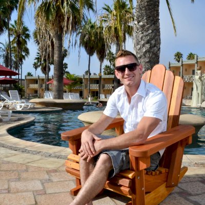 Adirondack Wooden Rocking Chair (Options: Standard Width, California Redwood, No Cushion, No Ottoman, Transparent Premium Sealant). Photo Courtesy of The Estero Beach Resort, Ensenada, Mexico.