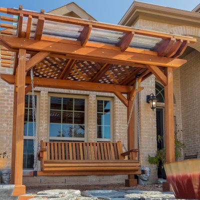 Angel's Trellis Swing (Options: 9' x 6', California Redwood, with Rain Guard, Classic Design Seat, 7.5' Posts by Custom Request, Post Anchoring for Concrete, Transparent Premium Sealant). Photo Courtesy of C. Edwards of Fort Worth, TX.