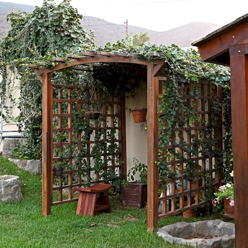 Arched Garden Arbor (Options: 48" W x 60" D, Mosaic Eco-Wood, No Anchor Kit, Transparent Premium Sealant). Photo Also Shows a Sanctuary Patio Bench. Photos taken after 4 years of installation. Arched Garden Arbor (Options: 48" W x 60" D, Mosaic Eco-Wood, No Anchor Kit, Transparent Premium Sealant). Photo Also Shows a Sanctuary Patio Bench. Photos taken after 4 years of installation.