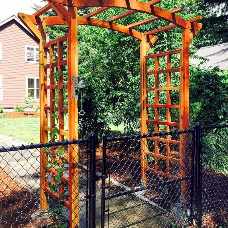Arched Garden Arbor (Options: 60" W x 36" D, California Redwood, No Anchor Kit, Transparent Premium Sealant). Photo Courtesy of Evelyn and Dan Martin of Poulsbo, Washington. Arched Garden Arbor (Options: 60" W x 36" D, California Redwood, No Anchor Kit, Transparent Premium Sealant). Photo Courtesy of Evelyn and Dan Martin of Poulsbo, Washington.