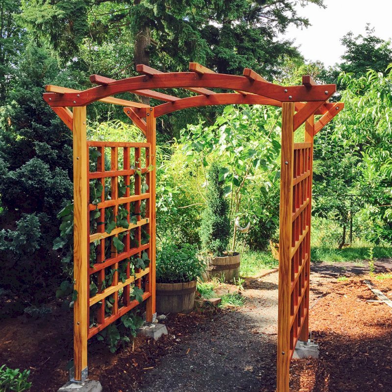 Arched Garden Arbor (Options: 48" W x 60" D, California Redwood, No Anchor Kit, Transparent Premium Sealant). Photo Courtesy of Evelyn and Dan Martin of Poulsbo, Washington. Arched Garden Arbor (Options: 48" W x 60" D, California Redwood, No Anchor Kit, Transparent Premium Sealant). Photo Courtesy of Evelyn and Dan Martin of Poulsbo, Washington.