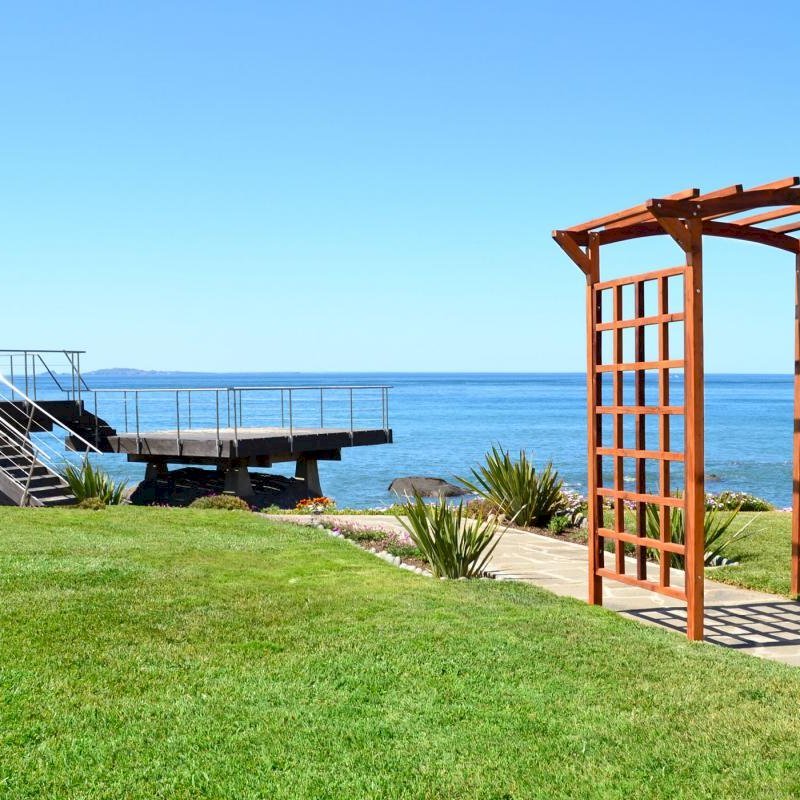 Arched Garden Arbor (Options: 96" W x 48" D, Mature Redwood, No Anchor Kit, Transparent Premium Sealant). Arched Garden Arbor (Options: 96" W x 48" D, Mature Redwood, No Anchor Kit, Transparent Premium Sealant).