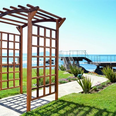 Arched Garden Arbor (Options: 96" W x 48" D, Mature Redwood, No Anchor Kit, Transparent Premium Sealant).