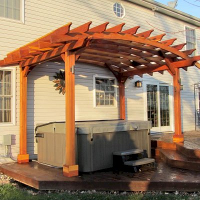 Arched Open Sky Pergolas (Options: 10' L  x 14' Arc W, California Redwood, Unattached, No Electrical Wiring Trim, Arched Roof without Lattice Panels, 4-Post Anchor Kit for Wood, No Ceiling Fan Base, No Privacy Panels, No Curtain Rods, 9'  Post Height [custom length for 2 posts], Transparent Premium Sealant). Photo Courtesy of Doug K. of Erie, Michigan.