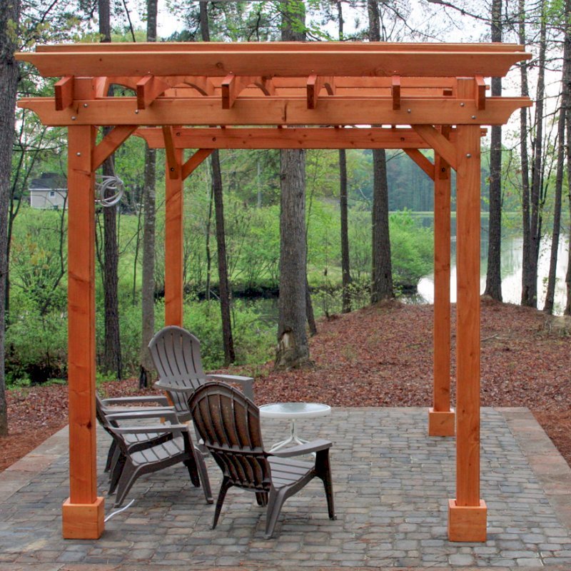 Arched Open Sky Pergolas (Options: 10' L x 14' Arc W, Mature Redwood, Unattached, No Electrical Wiring Trim, Arched Roof without Lattice Panels, 4 Post Anchor Kit for Stone, With Ceiling Fan Base, No Privacy Panels, No Curtain Rods, 9' Post Height, Transparent Premium Sealant). Photo Courtesy of Randall & Florence W. of Willow Spring, North Carolina. Arched Open Sky Pergolas (Options: 10' L x 14' Arc W, Mature Redwood, Unattached, No Electrical Wiring Trim, Arched Roof without Lattice Panels, 4 Post Anchor Kit for Stone, With Ceiling Fan Base, No Privacy Panels, No Curtain Rods, 9' Post Height, Transparent Premium Sealant). Photo Courtesy of Randall & Florence W. of Willow Spring, North Carolina.