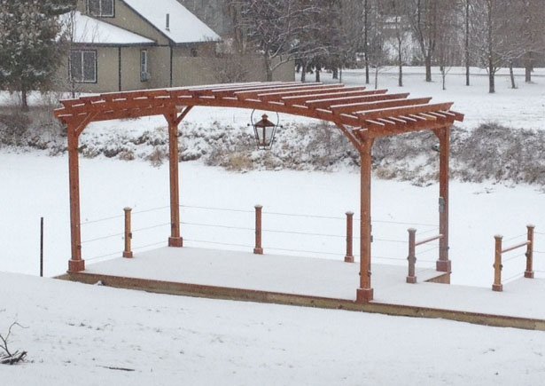 Arched Open Sky Pergolas (Options: 14' L x 22' Arc W, California Redwood, Unattached, No Electrical Wiring Trim, Arched Roof without Lattice Panels, 4 Post Anchor Kit for Stone, No Ceiling Fan Base, No Privacy Panels, No Curtain Rods, 9.5' Post Height, Transparent Premium Sealant). Photo courtesy of Douglas McGee of Clayton, New York. Arched Open Sky Pergolas (Options: 14' L x 22' Arc W, California Redwood, Unattached, No Electrical Wiring Trim, Arched Roof without Lattice Panels, 4 Post Anchor Kit for Stone, No Ceiling Fan Base, No Privacy Panels, No Curtain Rods, 9.5' Post Height, Transparent Premium Sealant). Photo courtesy of Douglas McGee of Clayton, New York.