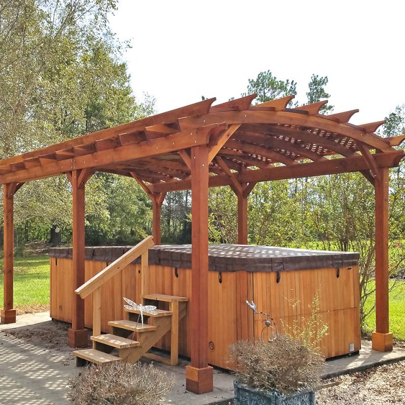 Arched Pergola Kit (Options: 22' L x 14' Arc W, California Redwood, Electrical Wiring Trim Kit for 2 Posts, 6 Post Anchor Kit for Concrete, 1 Ceiling Fan Base, No Privacy Panels, No Curtain Rods, 10' Post Height, Transparent Premium Sealant). Photo Courtesy of D. Lewis of Whiteville, North Carolina. Arched Pergola Kit (Options: 22' L x 14' Arc W, California Redwood, Electrical Wiring Trim Kit for 2 Posts, 6 Post Anchor Kit for Concrete, 1 Ceiling Fan Base, No Privacy Panels, No Curtain Rods, 10' Post Height, Transparent Premium Sealant). Photo Courtesy of D. Lewis of Whiteville, North Carolina.