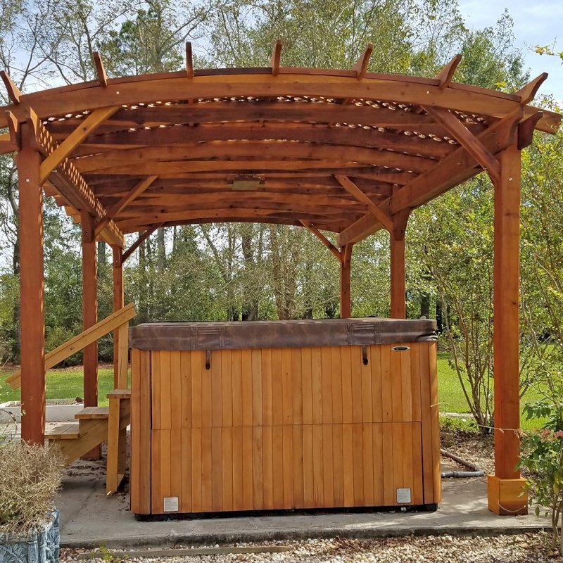 Arched Pergola Kit (Options: 22' L x 14' Arc W, California Redwood, Electrical Wiring Trim Kit for 2 Posts, 6 Post Anchor Kit for Concrete, 1 Ceiling Fan Base, No Privacy Panels, No Curtain Rods, 10' Post Height, Transparent Premium Sealant). Photo Courtesy of D. Lewis of Whiteville, North Carolina. Arched Pergola Kit (Options: 22' L x 14' Arc W, California Redwood, Electrical Wiring Trim Kit for 2 Posts, 6 Post Anchor Kit for Concrete, 1 Ceiling Fan Base, No Privacy Panels, No Curtain Rods, 10' Post Height, Transparent Premium Sealant). Photo Courtesy of D. Lewis of Whiteville, North Carolina.