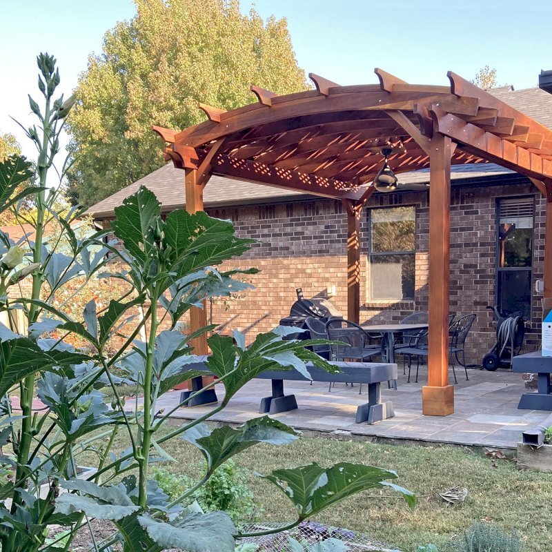 Arched Pergola Kits (Options: 14' L x 12' Arc W, California Redwood, 2 Electrical Wiring Trims, Arched Roof with Lattice Panels, 4 Post Anchor Kit for Concrete, 1 Ceiling Fan Base, No Privacy Panels, No Curtain Rods, Transparent Premium Sealant). Photo Courtesy of J. Treadway of Fayetteville, Arkansas. Arched Pergola Kits (Options: 14' L x 12' Arc W, California Redwood, 2 Electrical Wiring Trims, Arched Roof with Lattice Panels, 4 Post Anchor Kit for Concrete, 1 Ceiling Fan Base, No Privacy Panels, No Curtain Rods, Transparent Premium Sealant). Photo Courtesy of J. Treadway of Fayetteville, Arkansas.