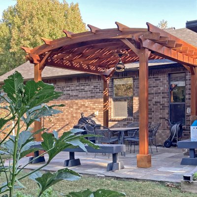Arched Pergola Kits (Options: 14' L x 12' Arc W, California Redwood, 2 Electrical Wiring Trims, 4-Post Anchor Kit for Concrete, 1 Ceiling Fan Base, No Privacy Panels, No Curtain Rods, Transparent Premium Sealant). Photo Courtesy of J. Treadway of Fayetteville, Arkansas.