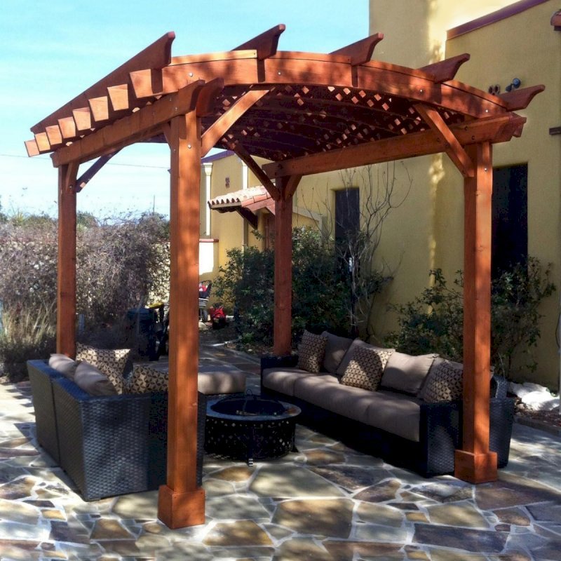 Arched Pergola Kits (Options: 12' L x 10' Arc W, California Redwood, Unattached, No Electrical Wiring Trim, Arched Roof with Lattice Panels, 4 Post Anchor Kit for Stone, No Ceiling Fan Base, No Privacy Panels, No Curtain Rods, 9' Post Height, Transparent Premium Sealant). Photo courtesy of Mr. Buzz Park of Spring Branch, Texas. Arched Pergola Kits (Options: 12' L x 10' Arc W, California Redwood, Unattached, No Electrical Wiring Trim, Arched Roof with Lattice Panels, 4 Post Anchor Kit for Stone, No Ceiling Fan Base, No Privacy Panels, No Curtain Rods, 9' Post Height, Transparent Premium Sealant). Photo courtesy of Mr. Buzz Park of Spring Branch, Texas.