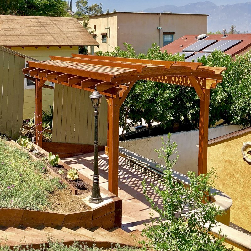 Arched Pergola Kit (Options: 16' L x 10' Arc W, California Redwood, Electrical Wiring Trim Kit for 1 Post, 4 Post Anchor Kit for Concrete, 1 Ceiling Fan Base, No Privacy Panels, No Curtain Rods, 9' Post Height, Transparent Premium Sealant). Photo Courtesy of D. Barreras of South Pasadena, CA. Arched Pergola Kit (Options: 16' L x 10' Arc W, California Redwood, Electrical Wiring Trim Kit for 1 Post, 4 Post Anchor Kit for Concrete, 1 Ceiling Fan Base, No Privacy Panels, No Curtain Rods, 9' Post Height, Transparent Premium Sealant). Photo Courtesy of D. Barreras of South Pasadena, CA.