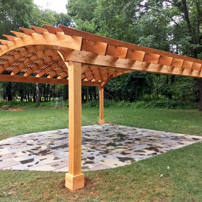 Arched Pergola Kit (Options: 24' L x 24' Arc W, Douglas-fir, Electrical Wiring Trim Kit for 2 Posts, 4 Post Anchor Kit for Gale-Wind, 1 Ceiling Fan Base, No Privacy Panels, No Curtain Rods, 9.5' Post Height, Transparent Premium Sealant). Photo Courtesy of D. Juiliano of Randolph, NJ. Arched Pergola Kit (Options: 24' L x 24' Arc W, Douglas-fir, Electrical Wiring Trim Kit for 2 Posts, 4 Post Anchor Kit for Gale-Wind, 1 Ceiling Fan Base, No Privacy Panels, No Curtain Rods, 9.5' Post Height, Transparent Premium Sealant). Photo Courtesy of D. Juiliano of Randolph, NJ.