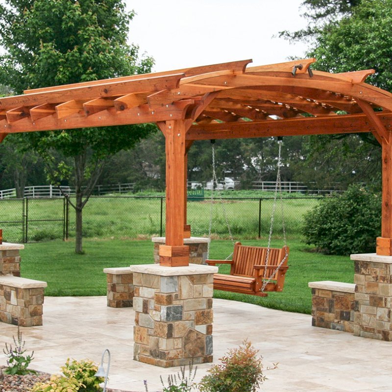 Arched Pergola Kits (Options: 16' L x 12' Arc W, California Redwood, Unattached, Electrical Wiring Trim for 1 Post, Arched Roof with Lattice Panels, 4 Post Anchor Kit for Concrete, No Ceiling Fan Base, No Privacy Panels, No Curtain Rods, 9' Post Height, Transparent Premium Sealant). With a Bench Swing by Custom Request. Photo Courtesy of Doug Kirkland of Valley Center, Kansas. Arched Pergola Kits (Options: 16' L x 12' Arc W, California Redwood, Unattached, Electrical Wiring Trim for 1 Post, Arched Roof with Lattice Panels, 4 Post Anchor Kit for Concrete, No Ceiling Fan Base, No Privacy Panels, No Curtain Rods, 9' Post Height, Transparent Premium Sealant). With a Bench Swing by Custom Request. Photo Courtesy of Doug Kirkland of Valley Center, Kansas.