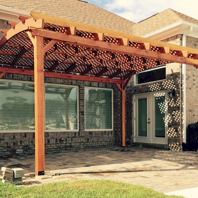 Arched Pergola Kits (Options: 18' L x 15' Arc W, Mature Redwood, Unattached, No Electrical Wiring Trim, Arched Roof with Lattice Panels, 4 Post Anchor Kit for Stone, No Ceiling Fan Base, No Privacy Panels, No Curtain Rods, 10' Post Height, Transparent Premium Sealant). Photo Courtesy of Andrew Snoddy of Little River, South Carolina. Arched Pergola Kits (Options: 18' L x 15' Arc W, Mature Redwood, Unattached, No Electrical Wiring Trim, Arched Roof with Lattice Panels, 4 Post Anchor Kit for Stone, No Ceiling Fan Base, No Privacy Panels, No Curtain Rods, 10' Post Height, Transparent Premium Sealant). Photo Courtesy of Andrew Snoddy of Little River, South Carolina.