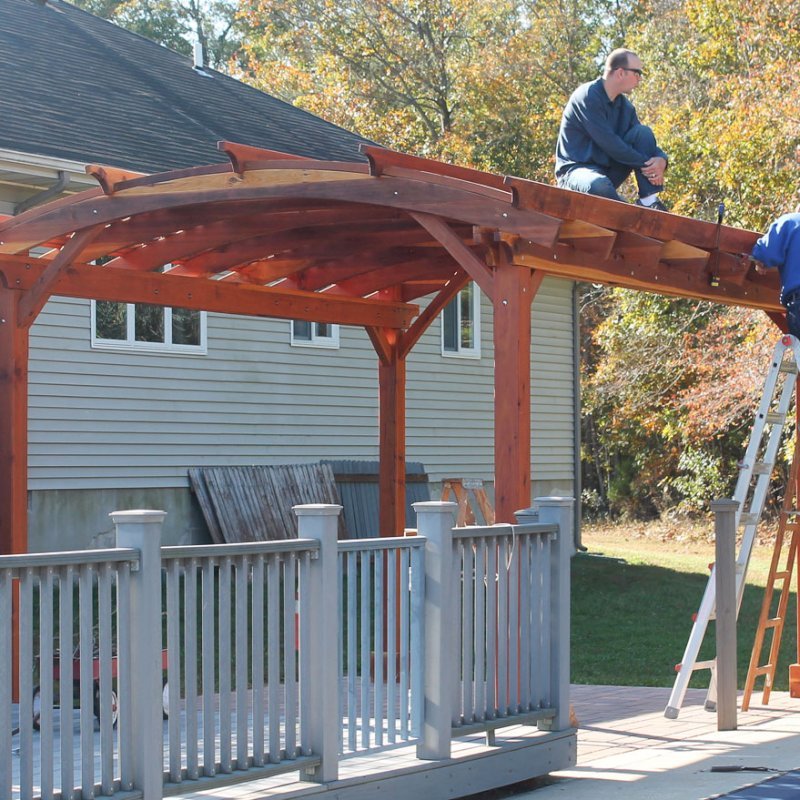 Arched Pergola Kits (Options: 16' L x 12' Arc W, California Redwood, Unattached, No Electrical Wiring Trim, Arched Roof with Lattice Panels, 4 Post Anchor Kit for Stone, Ceiling Fan Base, No Privacy Panels, No Curtain Rods, 9' Post Height, Transparent Premium Sealant). Photo Courtesy of Mr John & Virginia Mitchell of Greenwood, Delaware. Arched Pergola Kits (Options: 16' L x 12' Arc W, California Redwood, Unattached, No Electrical Wiring Trim, Arched Roof with Lattice Panels, 4 Post Anchor Kit for Stone, Ceiling Fan Base, No Privacy Panels, No Curtain Rods, 9' Post Height, Transparent Premium Sealant). Photo Courtesy of Mr John & Virginia Mitchell of Greenwood, Delaware.