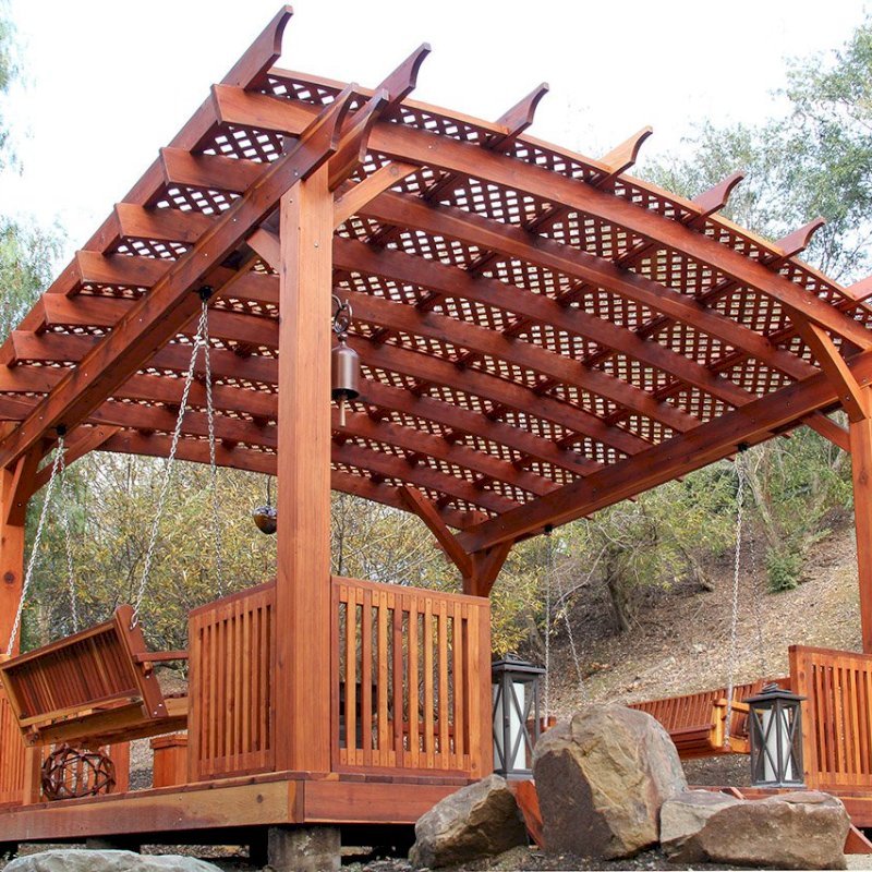 Arched Pergola Kits (Options: 18' x 18', Mature Redwood, 3 Degree Roof Slope by Custom Request, with Lattice Panels, with Deck and Railing by Custom Request, with a Bench Swing Seat). Photo Also Shows a Custom Storage Bench. Photo Courtesy of Bob P. of Westlake Village, CA. Arched Pergola Kits (Options: 18' x 18', Mature Redwood, 3 Degree Roof Slope by Custom Request, with Lattice Panels, with Deck and Railing by Custom Request, with a Bench Swing Seat). Photo Also Shows a Custom Storage Bench. Photo Courtesy of Bob P. of Westlake Village, CA.