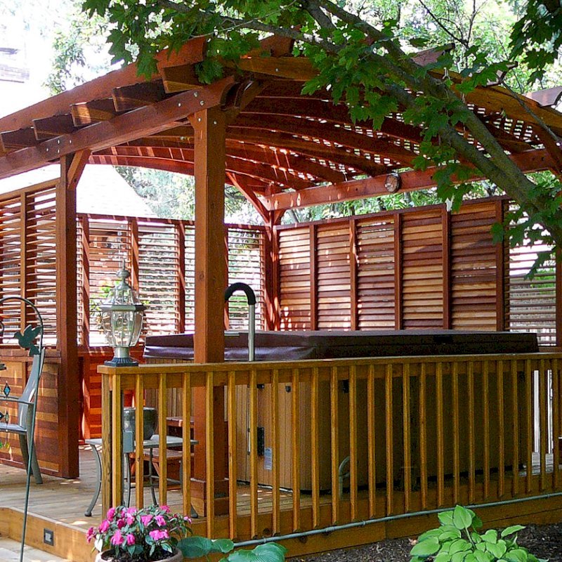 Arched Pergola Kits (Options: 16' L x 14' Arc W, With Wall Panel Louver Style, California Redwood, Unattached, No Electrical Wiring Trim, Arched Roof with Lattice Panels, 4 Post Anchor Kit for Stone, No Ceiling Fan Base, Privacy Panels, No Curtain Rods, 9' Post Height, Transparent Premium Sealant). Photo Courtesy of George Jackson of Commerce Township, Michigan. Arched Pergola Kits (Options: 16' L x 14' Arc W, With Wall Panel Louver Style, California Redwood, Unattached, No Electrical Wiring Trim, Arched Roof with Lattice Panels, 4 Post Anchor Kit for Stone, No Ceiling Fan Base, Privacy Panels, No Curtain Rods, 9' Post Height, Transparent Premium Sealant). Photo Courtesy of George Jackson of Commerce Township, Michigan.
