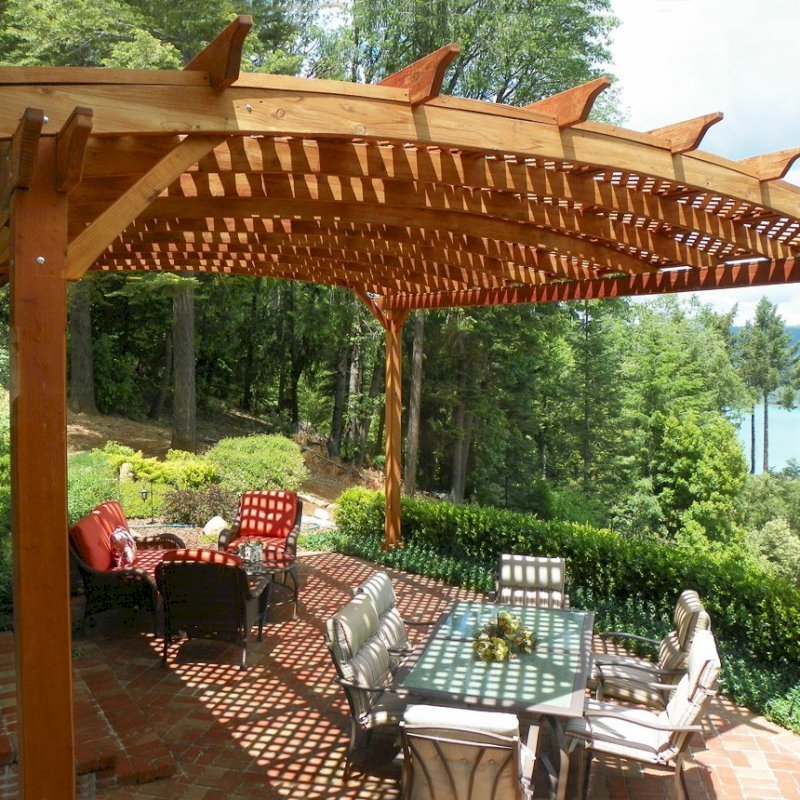 Arched Pergola Kits (Options: 20' L x 18' Arc W, Mature Redwood, Unattached, No Electrical Wiring Trim, Arched Roof with Lattice Panels, 4 Post Anchor kit for Stone, No Ceiling Fan Base, No Privacy Panels, No Curtain Rods, 10' Post Height, Transparent Premium Sealant). Photo Courtesy of Edward G. of Nevada City, CA. Arched Pergola Kits (Options: 20' L x 18' Arc W, Mature Redwood, Unattached, No Electrical Wiring Trim, Arched Roof with Lattice Panels, 4 Post Anchor kit for Stone, No Ceiling Fan Base, No Privacy Panels, No Curtain Rods, 10' Post Height, Transparent Premium Sealant). Photo Courtesy of Edward G. of Nevada City, CA.