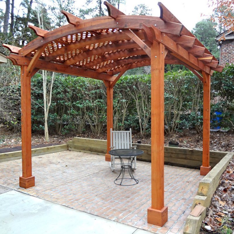 Arched Pergola Kits (Options: 12' L x 12' Arc W, Mature Redwood, Unattached, No Electrical Wiring Trim, Arched Roof with Lattice Panels, 4 Post Anchor Kit for Stone, No Ceiling Fan Base, No Privacy Panels, No Curtain Rods, 9' Post Height, Transparent Premium Sealant). Photo courtesy of Reuben Prichard of Raleigh, North Carolina. Arched Pergola Kits (Options: 12' L x 12' Arc W, Mature Redwood, Unattached, No Electrical Wiring Trim, Arched Roof with Lattice Panels, 4 Post Anchor Kit for Stone, No Ceiling Fan Base, No Privacy Panels, No Curtain Rods, 9' Post Height, Transparent Premium Sealant). Photo courtesy of Reuben Prichard of Raleigh, North Carolina.