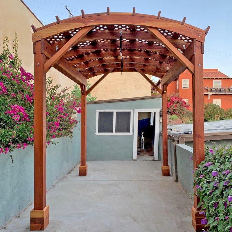 Arched Pergola Kit (Options: 12' L x 9' Arc W, California Redwood, No Overhangs by Custom Request, No Electrical Wiring Trim Kit, No Fan Base, No Privacy Panels, Transparent Premium Sealant). Photo Courtesy of R. Rabinov of Ventura, California. Arched Pergola Kit (Options: 12' L x 9' Arc W, California Redwood, No Overhangs by Custom Request, No Electrical Wiring Trim Kit, No Fan Base, No Privacy Panels, Transparent Premium Sealant). Photo Courtesy of R. Rabinov of Ventura, California.