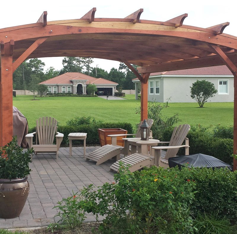 Arched Pergola Kits (Options: 16' L x 14' Arc W, California Redwood, Unattached, No Electrical Wiring Trim, Arched Roof with Lattice Panels, 4 Post Anchor Kit for Stone, No Ceiling Fan Base, No Privacy Panels, No Curtain Rods, 9' Post Height, Transparent Premium Sealant). Photo Courtesy of Scott and Elizabeth Tribbey of Miami, FL. Arched Pergola Kits (Options: 16' L x 14' Arc W, California Redwood, Unattached, No Electrical Wiring Trim, Arched Roof with Lattice Panels, 4 Post Anchor Kit for Stone, No Ceiling Fan Base, No Privacy Panels, No Curtain Rods, 9' Post Height, Transparent Premium Sealant). Photo Courtesy of Scott and Elizabeth Tribbey of Miami, FL.