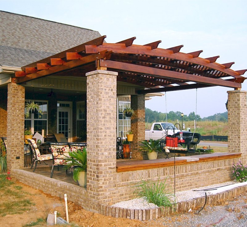 Arched Pergola Kits (Options: 14' L x 18' Arc W, California Redwood, Attached, No Electrical Wiring Trim, Arched Roof with Lattice Panels, 4 Post Anchor Kit for Stone, No Ceiling Fan Base, No Privacy Panel, No Curtain Rods, 9' Post Height, Transparent Premium Sealant). Posts wrapped in masonry. Photo courtesy of Mr. Brandon Campbell of Lenoir City, TN. Arched Pergola Kits (Options: 14' L x 18' Arc W, California Redwood, Attached, No Electrical Wiring Trim, Arched Roof with Lattice Panels, 4 Post Anchor Kit for Stone, No Ceiling Fan Base, No Privacy Panel, No Curtain Rods, 9' Post Height, Transparent Premium Sealant). Posts wrapped in masonry. Photo courtesy of Mr. Brandon Campbell of Lenoir City, TN.