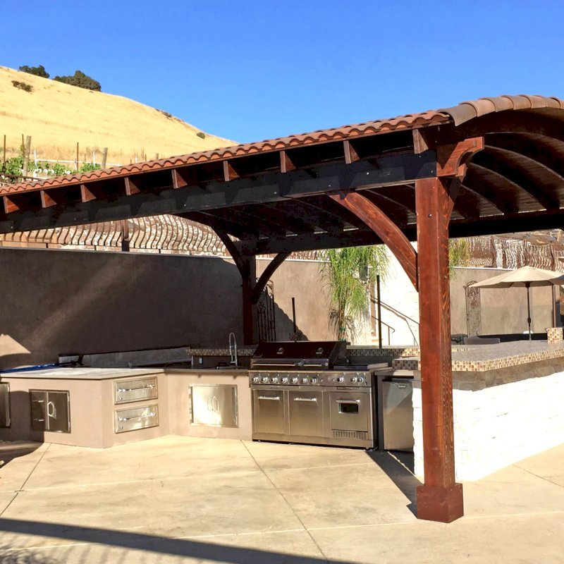 Arched Thick Timber Pavilion (Options: 24' L x 22' Arc W, California Redwood, No Electrical Wiring Trim, 4 Post Anchor Kit for Concrete, No Ceiling Fan Base, No Privacy Panel, No Curtain Rods, 10ft H, Transparent Premium Sealant). Arched Thick Timber Pavilion (Options: 24' L x 22' Arc W, California Redwood, No Electrical Wiring Trim, 4 Post Anchor Kit for Concrete, No Ceiling Fan Base, No Privacy Panel, No Curtain Rods, 10ft H, Transparent Premium Sealant).