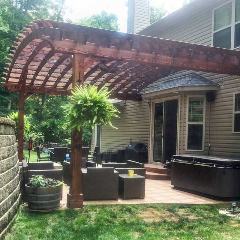 Attached Arched Pergola Kits (Options: 20' L x 26' W, Douglas-fir, No Electrical Wiring Trim, Rafters at 18" and Slats at 18", Widthwise Roof Support Timbers, 2-Post Anchor Kit for Concrete, Ceiling Fan Base, No Privacy Panels, No Curtain Rods, 11' Post Height, Coffee-Stain Premium Sealant). Photo Courtesy of Susanne Stephens of Eureka, Missouri. Attached Arched Pergola Kits (Options: 20' L x 26' W, Douglas-fir, No Electrical Wiring Trim, Rafters at 18" and Slats at 18", Widthwise Roof Support Timbers, 2-Post Anchor Kit for Concrete, Ceiling Fan Base, No Privacy Panels, No Curtain Rods, 11' Post Height, Coffee-Stain Premium Sealant). Photo Courtesy of Susanne Stephens of Eureka, Missouri.