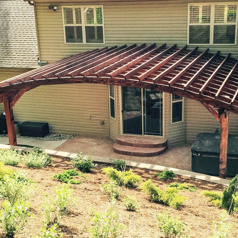 Attached Arched Pergola Kits (Options: 20' L x 26' W, Douglas-fir, No Electrical Wiring Trim, Rafters at 18" and Slats at 18", Widthwise Roof Support Timbers, 2-Post Anchor Kit for Concrete, Ceiling Fan Base, No Privacy Panels, No Curtain Rods, 11' Post Height, Coffee-Stain Premium Sealant). Photo Courtesy of Susanne Stephens of Eureka, Missouri. Attached Arched Pergola Kits (Options: 20' L x 26' W, Douglas-fir, No Electrical Wiring Trim, Rafters at 18" and Slats at 18", Widthwise Roof Support Timbers, 2-Post Anchor Kit for Concrete, Ceiling Fan Base, No Privacy Panels, No Curtain Rods, 11' Post Height, Coffee-Stain Premium Sealant). Photo Courtesy of Susanne Stephens of Eureka, Missouri.