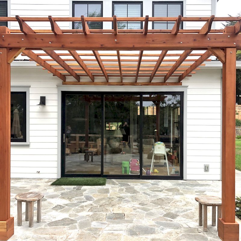 Attached Garden Pergola (Options: 14' x 13', California Redwood, Open Roof with Slats at 18", Rafters at 18", 2-Post Anchor Kit for Concrete, No Ceiling Fan Base, Transparent Premium Sealant). Photo Courtesy of B. Tewksbury of Mill Valley, California. Attached Garden Pergola (Options: 14' x 13', California Redwood, Open Roof with Slats at 18", Rafters at 18", 2-Post Anchor Kit for Concrete, No Ceiling Fan Base, Transparent Premium Sealant). Photo Courtesy of B. Tewksbury of Mill Valley, California.