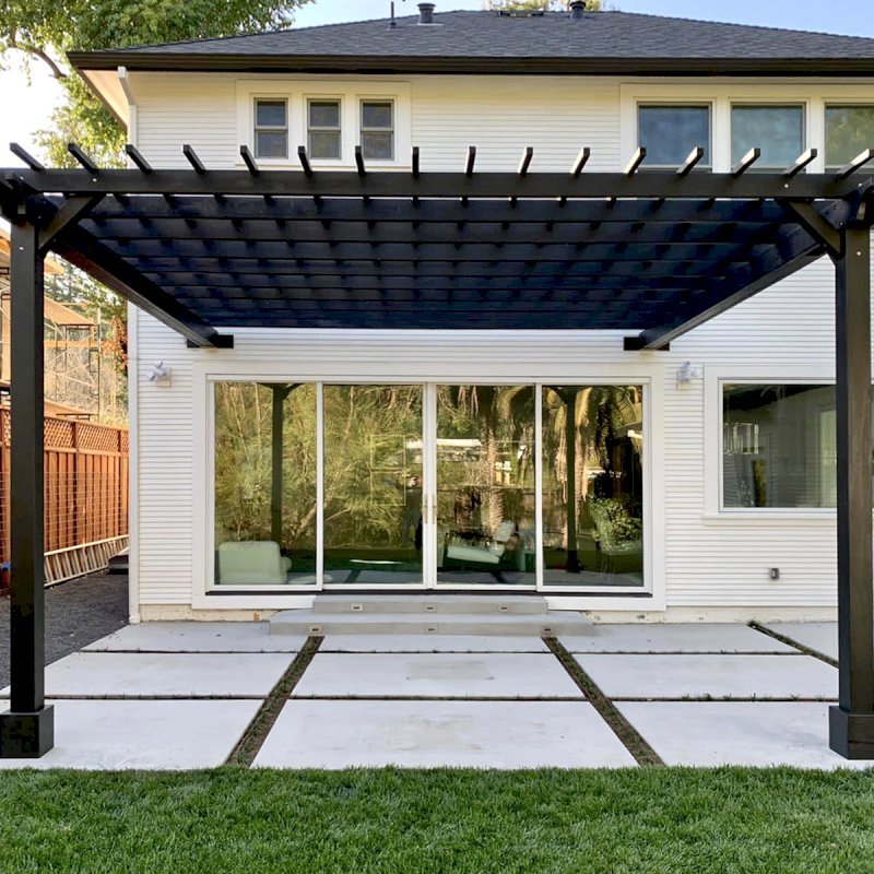 Attached Garden Pergola (Options: 18' x 16', California Redwood, Open Roof with Slats at 12", Rafters at 18", 2-Post Anchor Kit for Concrete, No Ceiling Fan Base, Black Stain Premium Sealant). Photo Courtesy of D. Murphy of San Anselmo, CA. Attached Garden Pergola (Options: 18' x 16', California Redwood, Open Roof with Slats at 12", Rafters at 18", 2-Post Anchor Kit for Concrete, No Ceiling Fan Base, Black Stain Premium Sealant). Photo Courtesy of D. Murphy of San Anselmo, CA.
