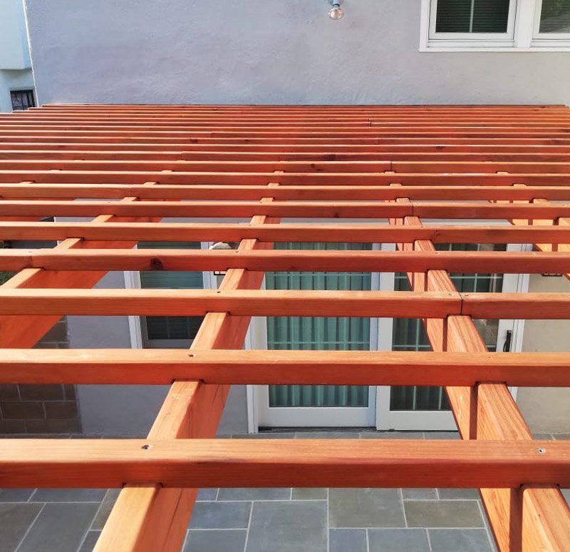 Attached Garden Pergola (Options: 13'-6" x 16'-6", Mature Redwood, Open Roof with Slats at 6", Rafters at 18", 2-Post Anchor Kit for Concrete, No Ceiling Fan Base, Transparent Premium Sealant). Photo Courtesy of J. Mason of Alameda, California. Attached Garden Pergola (Options: 13'-6" x 16'-6", Mature Redwood, Open Roof with Slats at 6", Rafters at 18", 2-Post Anchor Kit for Concrete, No Ceiling Fan Base, Transparent Premium Sealant). Photo Courtesy of J. Mason of Alameda, California.