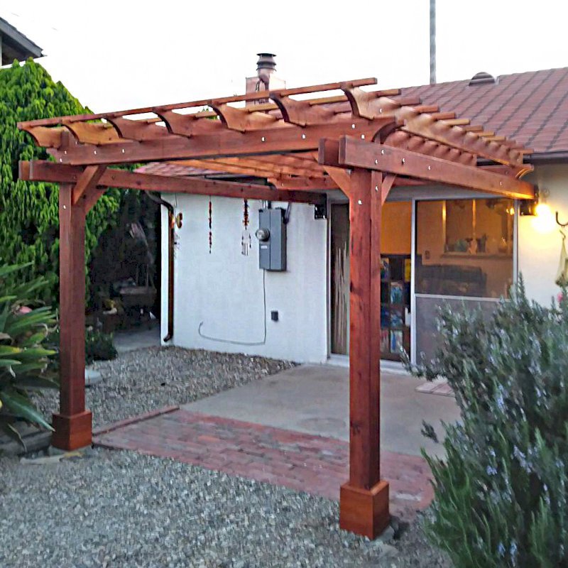 Attached Garden Pergolas (Options: 10' x 12', California Redwood, Open Roof with Slats at 12", Rafters at 18", 2-Post Anchor Kit for Concrete, Transparent Premium Sealant). Photo Courtesy of F. Butcher of Santa Barbara, CA. Attached Garden Pergolas (Options: 10' x 12', California Redwood, Open Roof with Slats at 12", Rafters at 18", 2-Post Anchor Kit for Concrete, Transparent Premium Sealant). Photo Courtesy of F. Butcher of Santa Barbara, CA.
