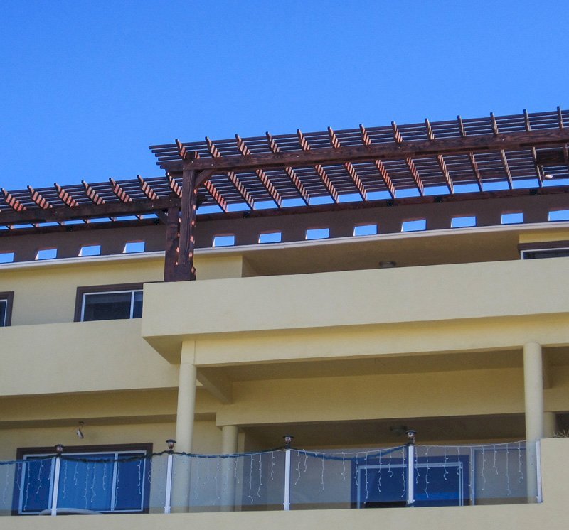 Attached Garden Pergolas (Options: 16' x 5' & 25' x 9', Attached to Wall by Support Side, Douglas-fir, No Electrical Wiring Trim, Posts Attached Atop this Load Bearing Wall, Open Roof with Slats at 12", Coffee-Stain Premium Sealant). Photo Courtesy of A. Gonzalez of Ensenada, B.C. Attached Garden Pergolas (Options: 16' x 5' & 25' x 9', Attached to Wall by Support Side, Douglas-fir, No Electrical Wiring Trim, Posts Attached Atop this Load Bearing Wall, Open Roof with Slats at 12", Coffee-Stain Premium Sealant). Photo Courtesy of A. Gonzalez of Ensenada, B.C.
