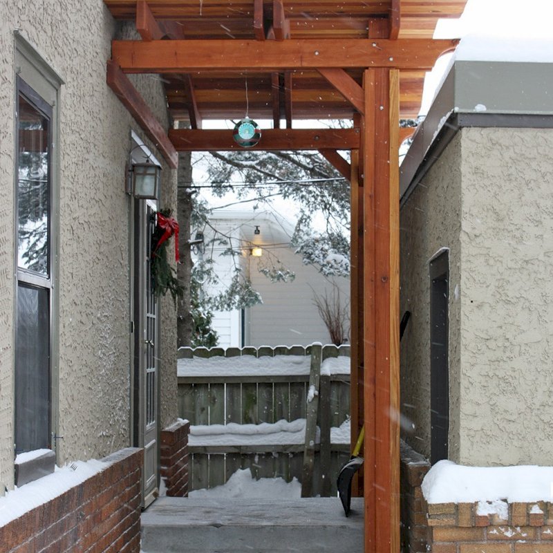 Attached Pavilion (Options: Lifestyle roof style, 6'L x 10'W, California Redwood, 2 Post Anchor Kit for Stone, Brick or Concrete, No Electrical Wiring Trim, 10ft Post Height, No Ceiling Fan Base, No Curtain Rods, No Privacy Panels, Transparent Premium Sealant). Photo Courtesy of John E. of Maplewood, Minnesota. Attached Pavilion (Options: Lifestyle roof style, 6'L x 10'W, California Redwood, 2 Post Anchor Kit for Stone, Brick or Concrete, No Electrical Wiring Trim, 10ft Post Height, No Ceiling Fan Base, No Curtain Rods, No Privacy Panels, Transparent Premium Sealant). Photo Courtesy of John E. of Maplewood, Minnesota.