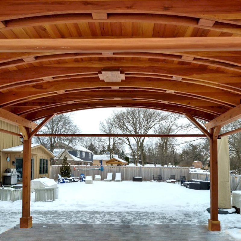Backyard Pavilion Kits (Options: 15' L x 18' Arc W, California Redwood, 2 Post Electrical Wiring Trims, 4 Post Anchor Kit for Concrete, 1 Ceiling Fan Base, No Privacy Panels, 4 Curtain Rods, 9 ft Post Height, Transparent Premium Sealant). Photo Courtesy of M. McDonald of Lake Barrington, Illinois. Backyard Pavilion Kits (Options: 15' L x 18' Arc W, California Redwood, 2 Post Electrical Wiring Trims, 4 Post Anchor Kit for Concrete, 1 Ceiling Fan Base, No Privacy Panels, 4 Curtain Rods, 9 ft Post Height, Transparent Premium Sealant). Photo Courtesy of M. McDonald of Lake Barrington, Illinois.
