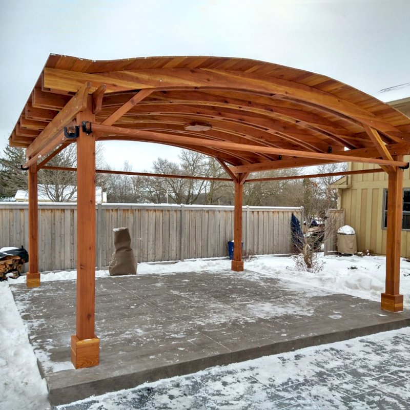 Backyard Pavilion Kits (Options: 15' L x 18' Arc W, California Redwood, 2 Post Electrical Wiring Trims, 4 Post Anchor Kit for Concrete, 1 Ceiling Fan Base, No Privacy Panels, 4 Curtain Rods, 9 ft Post Height, Transparent Premium Sealant). Photo Courtesy of M. McDonald of Lake Barrington, Illinois. Backyard Pavilion Kits (Options: 15' L x 18' Arc W, California Redwood, 2 Post Electrical Wiring Trims, 4 Post Anchor Kit for Concrete, 1 Ceiling Fan Base, No Privacy Panels, 4 Curtain Rods, 9 ft Post Height, Transparent Premium Sealant). Photo Courtesy of M. McDonald of Lake Barrington, Illinois.