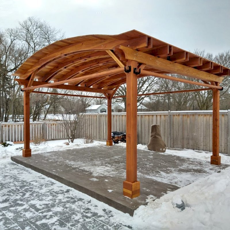 Backyard Pavilion Kits (Options: 15' L x 18' Arc W, California Redwood, 2 Post Electrical Wiring Trims, 4 Post Anchor Kit for Concrete, 1 Ceiling Fan Base, No Privacy Panels, 4 Curtain Rods, 9 ft Post Height, Transparent Premium Sealant). Photo Courtesy of M. McDonald of Lake Barrington, Illinois. Backyard Pavilion Kits (Options: 15' L x 18' Arc W, California Redwood, 2 Post Electrical Wiring Trims, 4 Post Anchor Kit for Concrete, 1 Ceiling Fan Base, No Privacy Panels, 4 Curtain Rods, 9 ft Post Height, Transparent Premium Sealant). Photo Courtesy of M. McDonald of Lake Barrington, Illinois.