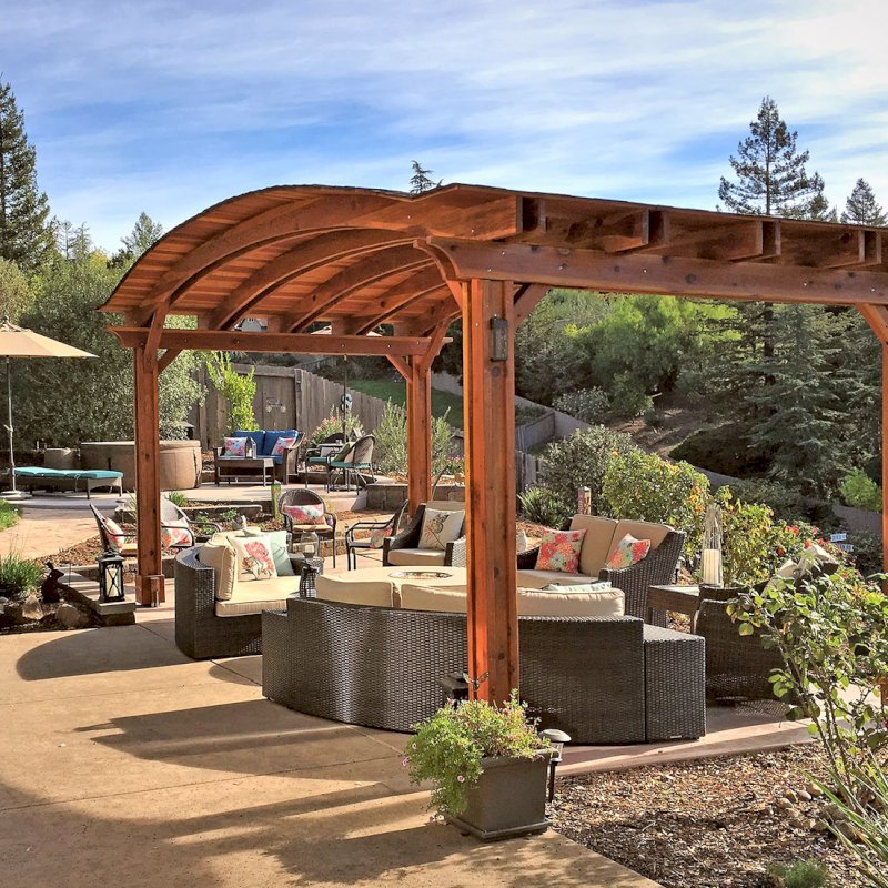 Backyard Pavilion Kits (Options: 12' L x 22' Arc W, California Redwood, No Electrical Wiring Trim, 4 Post Anchor Kit for Gale-Wind, No Ceiling Fan Base, No Privacy Panels, No Curtain Rods, 9.5 ft Post Height, Transparent Premium Sealant). Photo Courtesy of S. Bell of Santa Rosa, CA. Backyard Pavilion Kits (Options: 12' L x 22' Arc W, California Redwood, No Electrical Wiring Trim, 4 Post Anchor Kit for Gale-Wind, No Ceiling Fan Base, No Privacy Panels, No Curtain Rods, 9.5 ft Post Height, Transparent Premium Sealant). Photo Courtesy of S. Bell of Santa Rosa, CA.
