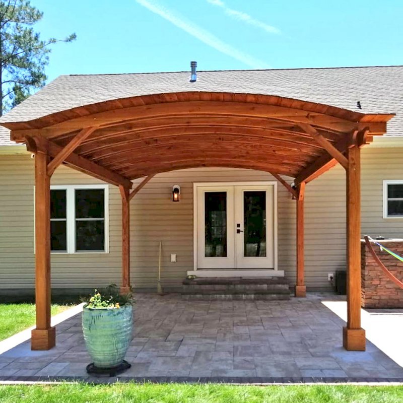 Backyard Pavilion Kits (Options: 16' L x 15' Arc W, Douglas-fir, No Post Electrical Wiring Trim, 4 Post Anchor Kit for Concrete, No Ceiling Fan Base, No Privacy Panels, No Curtain Rods, 9 ft Post Height, Transparent Premium Sealant). Photo Courtesy of S. Fly of Millsboro, Delaware. Backyard Pavilion Kits (Options: 16' L x 15' Arc W, Douglas-fir, No Post Electrical Wiring Trim, 4 Post Anchor Kit for Concrete, No Ceiling Fan Base, No Privacy Panels, No Curtain Rods, 9 ft Post Height, Transparent Premium Sealant). Photo Courtesy of S. Fly of Millsboro, Delaware.