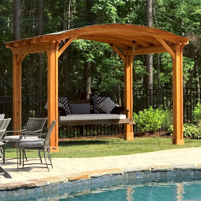 Backyard Pavilion Kits (Options: 12' L x 10' Arc W, Douglas-fir, No Electrical Wiring Trim, 4 Post Anchor Kit for Gale-Wind, No Ceiling Fan Base, No Privacy Panels, No Curtain Rods, 9 ft Post Height, Transparent Premium Sealant). Swing added by customer. Photo Courtesy of E. Schechtman of Wake Forest, NC. Backyard Pavilion Kits (Options: 12' L x 10' Arc W, Douglas-fir, No Electrical Wiring Trim, 4 Post Anchor Kit for Gale-Wind, No Ceiling Fan Base, No Privacy Panels, No Curtain Rods, 9 ft Post Height, Transparent Premium Sealant). Swing added by customer. Photo Courtesy of E. Schechtman of Wake Forest, NC.