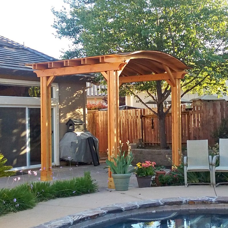 Backyard Pavilion Kits (Options: 12' L x 10' Arc W, Douglas-fir, 1 Post Electrical Wiring Trim, 4 Post Anchor Kit for Concrete, Add Ceiling Fan Base, No Privacy Panels, No Curtain Rods, 9 ft Post Height, Transparent Premium Sealant). Photo Courtesy of R. Short of Roseville, CA. Backyard Pavilion Kits (Options: 12' L x 10' Arc W, Douglas-fir, 1 Post Electrical Wiring Trim, 4 Post Anchor Kit for Concrete, Add Ceiling Fan Base, No Privacy Panels, No Curtain Rods, 9 ft Post Height, Transparent Premium Sealant). Photo Courtesy of R. Short of Roseville, CA.