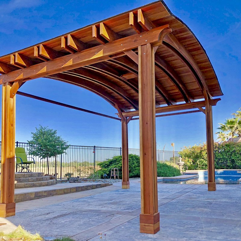 Backyard Pavilion Kits (Options: 14' L x 22' Arc W, California Redwood, 1 Post Electrical Wiring Trim, 4 Post Anchor Kit for Concrete, With 2 Ceiling Fan Bases, No Privacy Panels, 2 Curtain Rods, 9.5 ft Post Height, Transparent Premium Sealant). Photo Courtesy of T. Bauer of Sacramento, CA. Backyard Pavilion Kits (Options: 14' L x 22' Arc W, California Redwood, 1 Post Electrical Wiring Trim, 4 Post Anchor Kit for Concrete, With 2 Ceiling Fan Bases, No Privacy Panels, 2 Curtain Rods, 9.5 ft Post Height, Transparent Premium Sealant). Photo Courtesy of T. Bauer of Sacramento, CA.