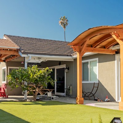 Backyard Porch Pavilion (Options: 8 'L x 10' W, Douglas-fir, 2-Post Anchor Kit for Concrete, No Electrical Wiring Trim, 8 ft Post Height, No Ceiling Fan Base, No Curtain Rods, No Privacy Panels, Transparent Premium Sealant). Photo Courtesy J. Clark of San Diego, CA.